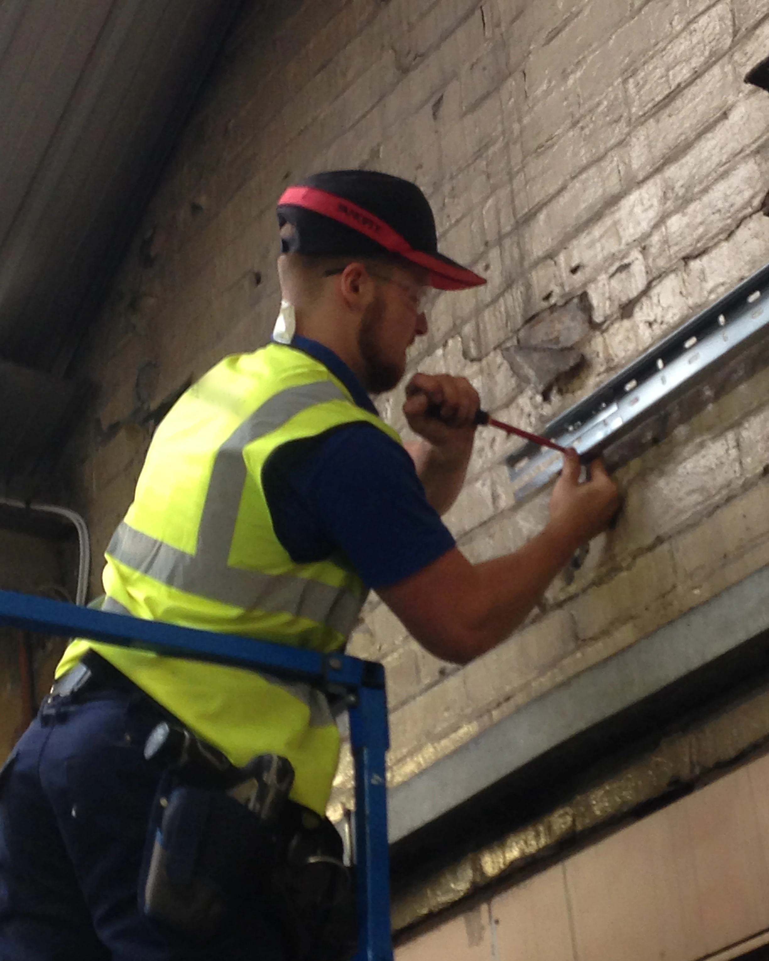 David Lander, founder of Jomioz, at work as an electrician